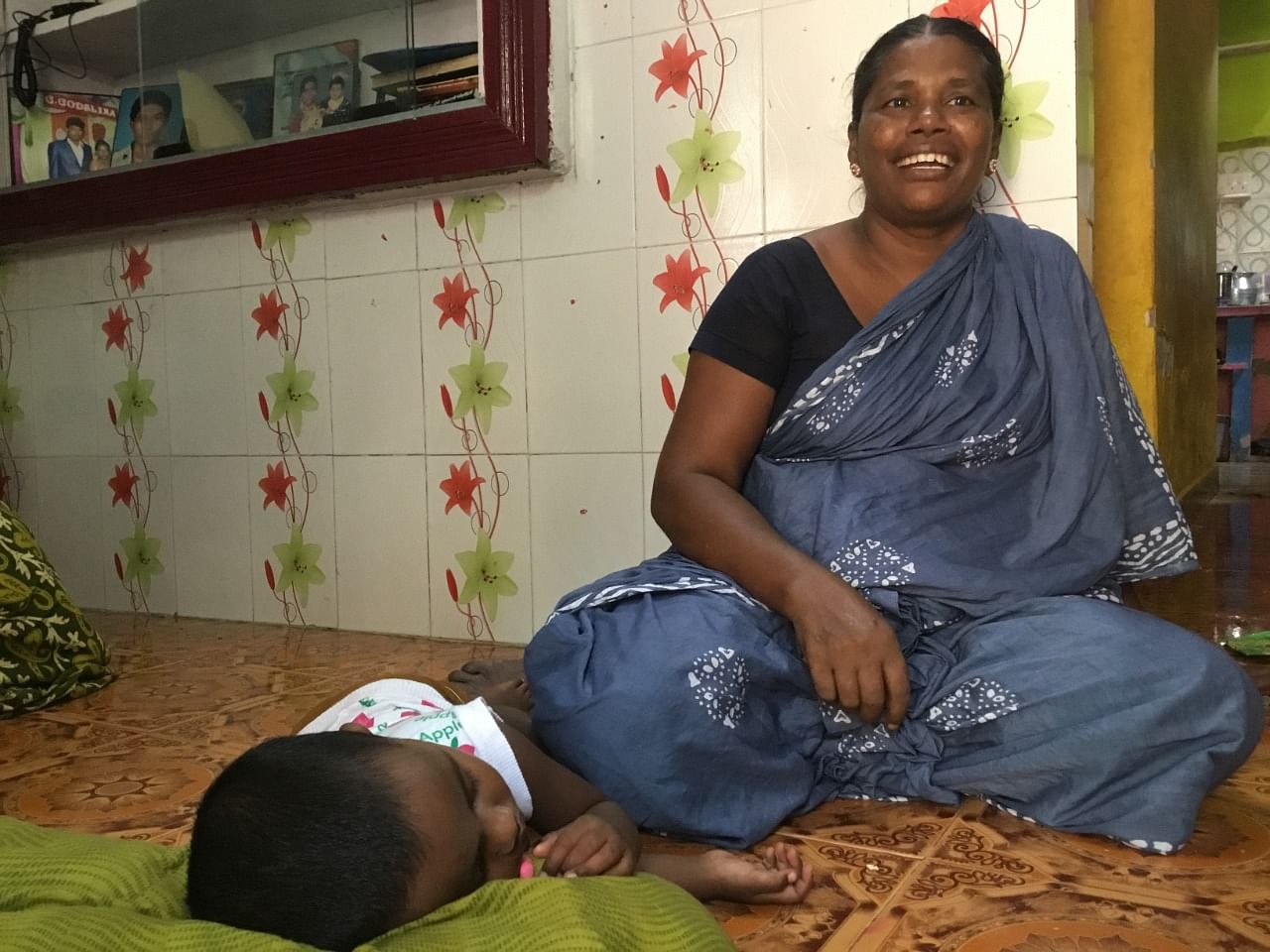 Vanitha, Snowlin's mother, putting her granddaughter Jibansi to sleep at her house in Thoothukudi. DH file photo