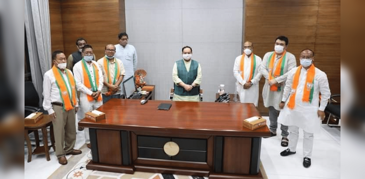  Former Congress MLAs meeting BJP president JP Nadda in New Delhi on Wednesday. Credit: DH