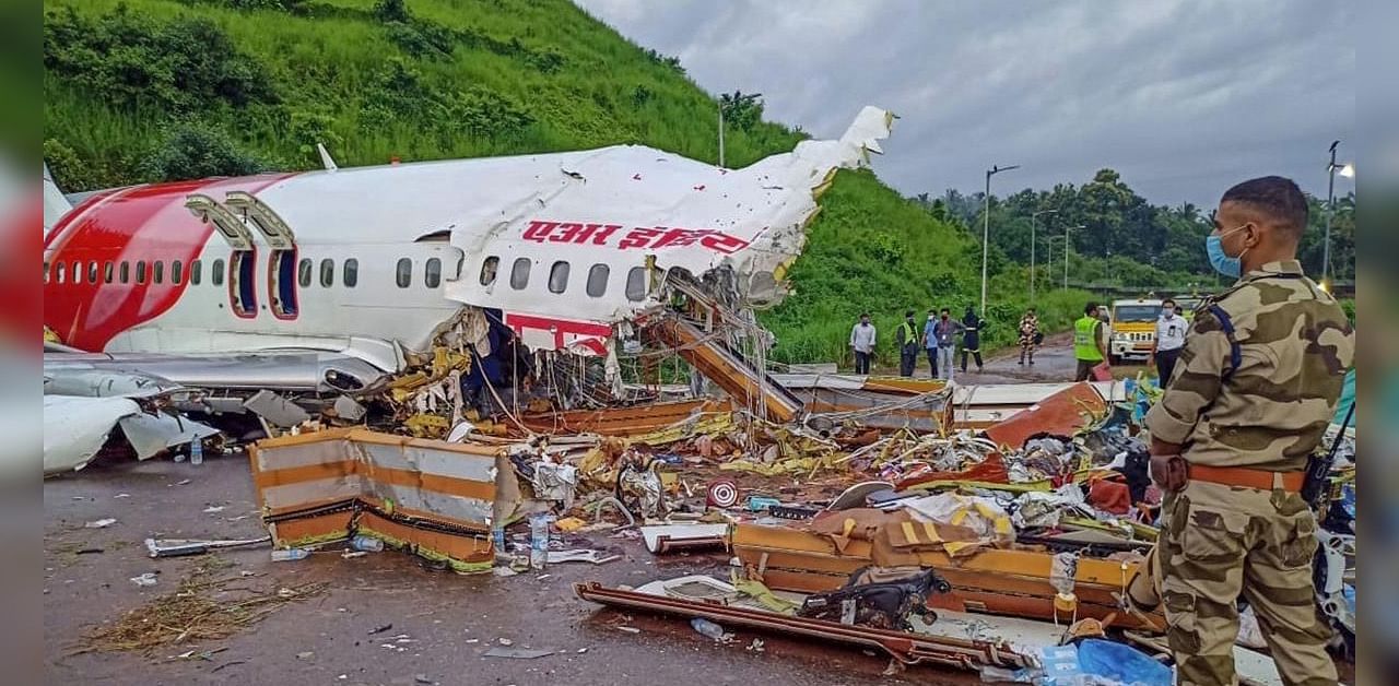 Nineteen people, including the pilot and co-pilot, were killed and several injured when the flight with 190 people on board overshot the table-top runway. Credits: PTI