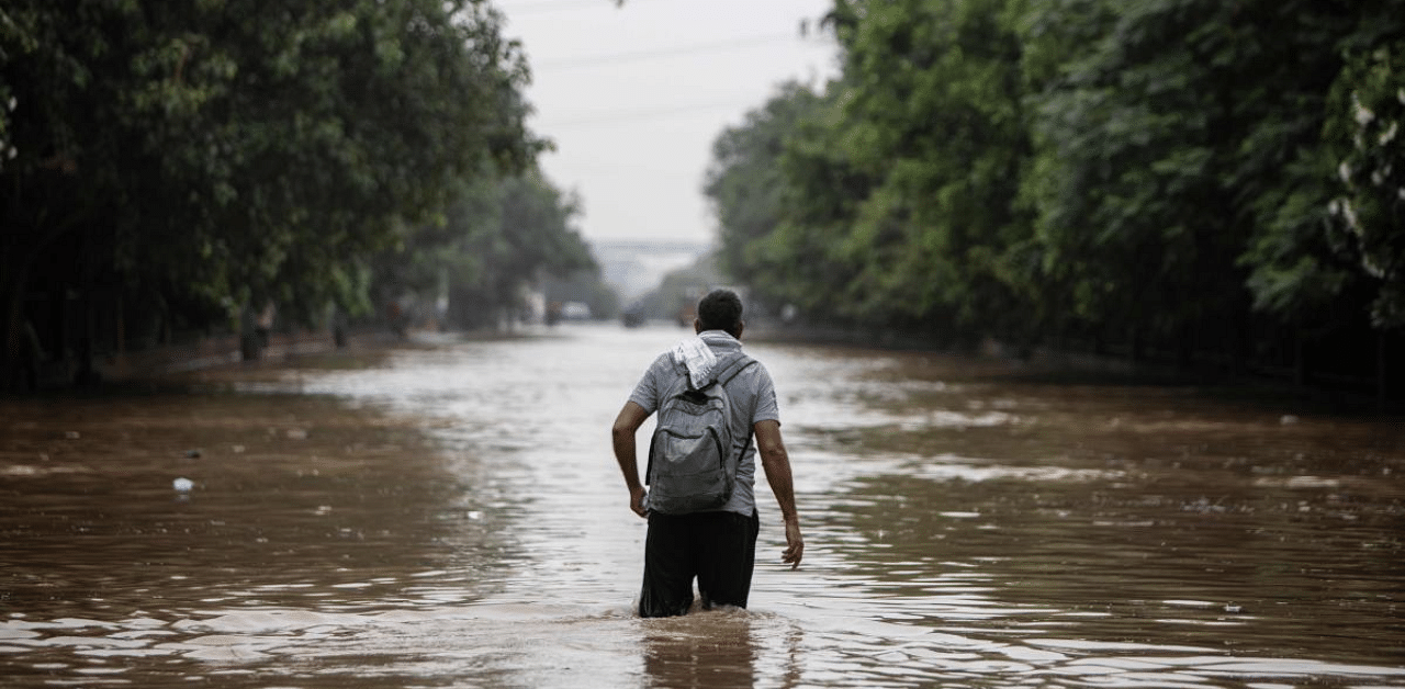 Heavy monsoon rains lashed New Delhi inundating roads and piling on misery for commuters in the chaotic Indian capital. Credit: AFP Photo