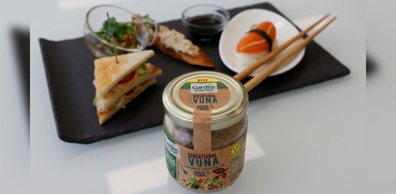 A jar of Sensationnal Vuna, a plant-based tuna product made by Garden Gourmet, is pictured in front of a plate with food at Nestle research center at Vers-chez-les-Blanc in Lausanne, Switzerland August 20, 2020. Credit: REUTERS