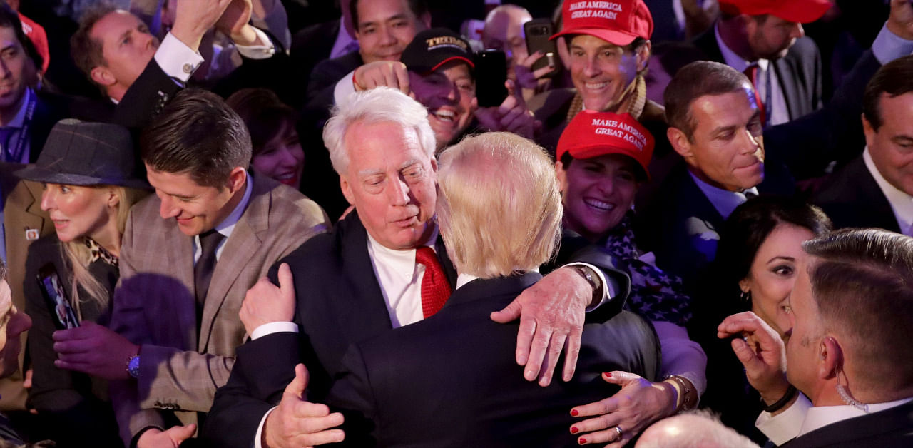 In this file photo taken on November 09, 2016 Republican president-elect Donald Trump (front) hugs his brother Robert Trump after delivering his acceptance speech in New York City. Credit: AFP Photo