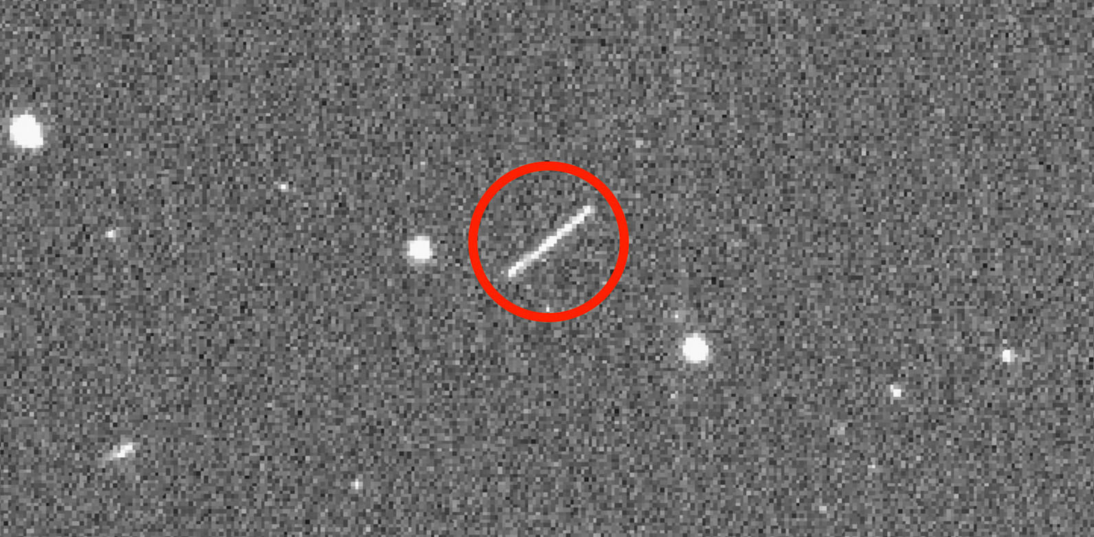 This NASA/JPL/ZTF/Caltech Optical Observatories handout image obtained on August 18, 2020 shows asteroid 2020 QG (the circled streak in the center) which came closer to Earth than any other nonimpacting asteroid on record. It was detected by the Zwicky Transient Facility on Sunday, Aug. 16 at 12:08 a.m. EDT (Saturday, Aug. 15 at 9:08 p.m. PDT). Credit: AFP