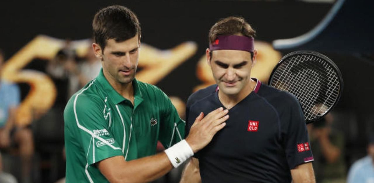 Serbia's Novak Djokovic pats Switzerland's Roger Federer after their match. Credit: Reuters