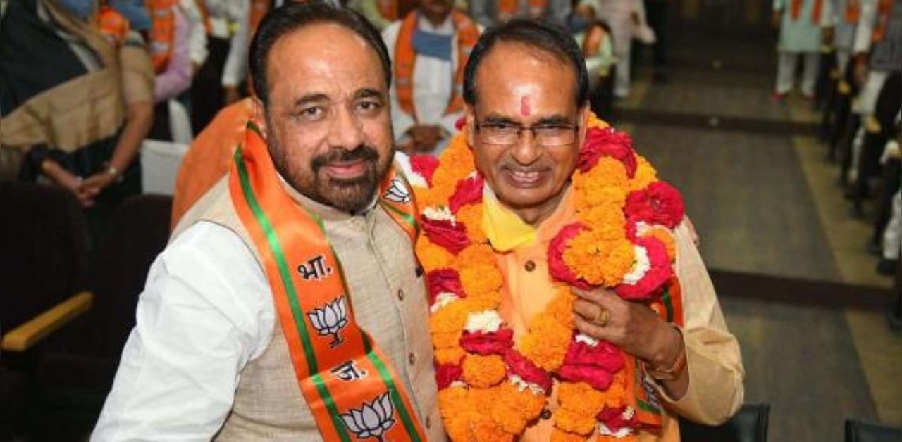 Chief Minister Shivraj Singh Chouhan (R) with party leader Gopal Bhargava (L). Credit: PTI Photo