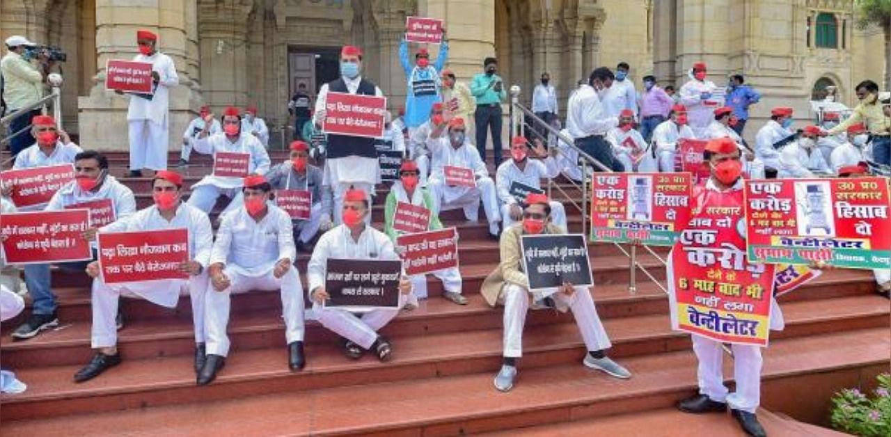 Samajwadi Party leaders stage a protest against the state government on the first day of UP Assembly session, amid the ongoing coronavirus pandemic, in Lucknow. Credit: PTI Photo