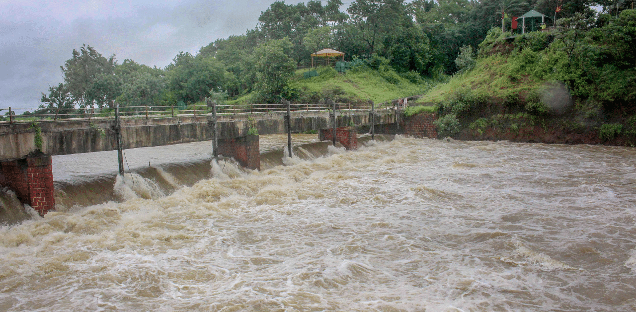 Water overflows from the gates of Kerwa Dam, due to rise in water level following heavy rains, in Bhopal district,