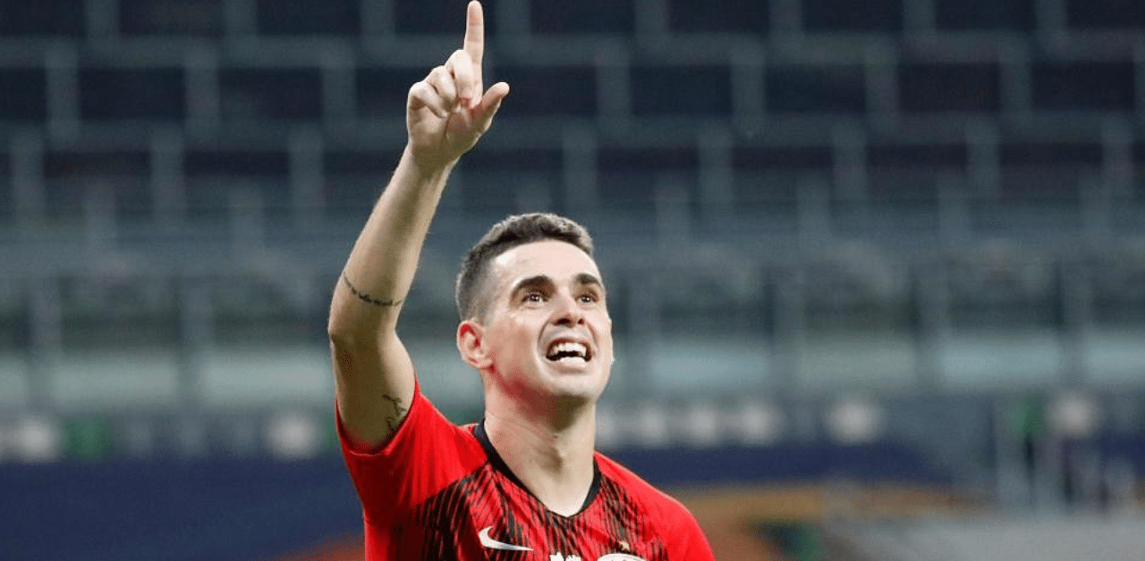 Shanghai SIPG's Oscar gestures to fans during the team's Chinese Super League football match. Credit: AFP