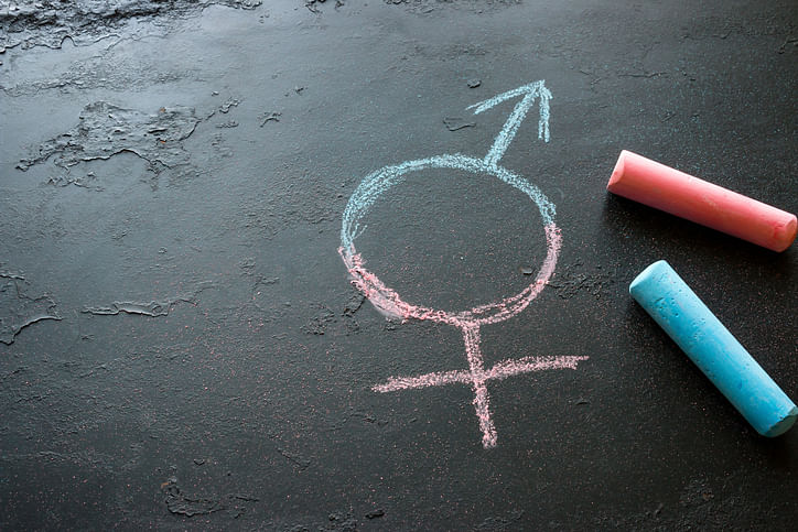 Colorful crayons and a symbol of a transgender (iStock)