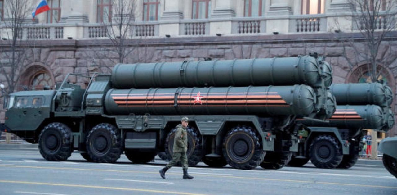 A Russian serviceman walks past S-400 missile air defence systems. Credit: Reuters