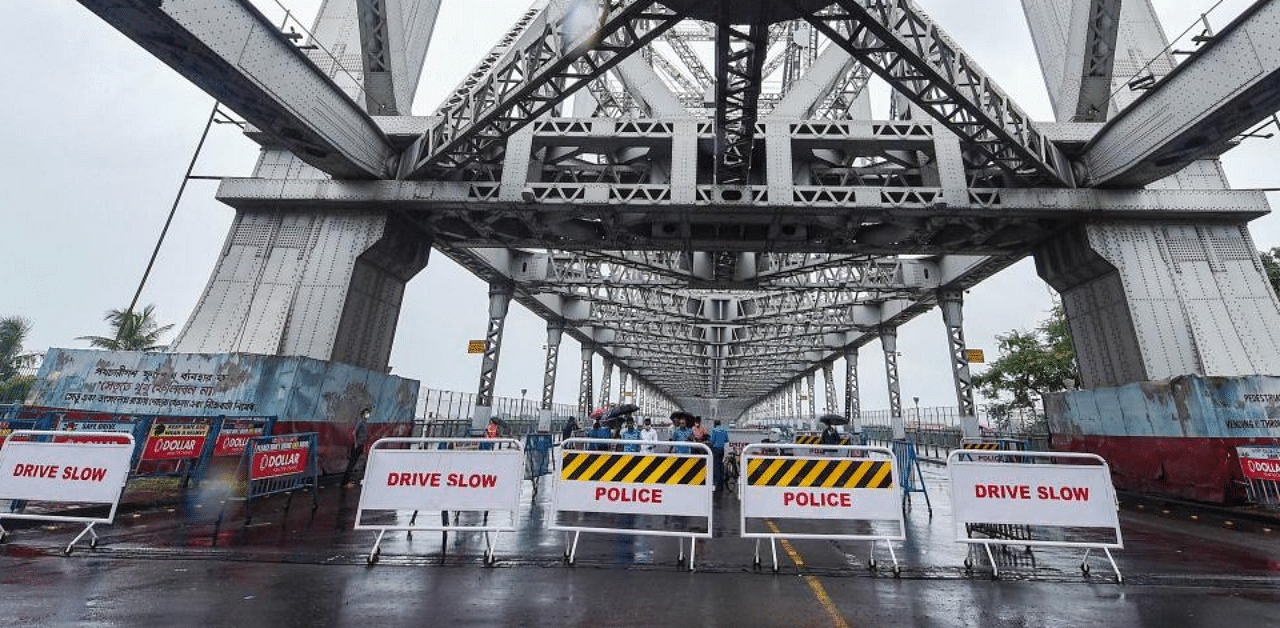  Barricades are placed on Howrah bridge during the biweekly lockdown in the wake of coronavirus pandemic, in Kolkata, Thursday, Aug 20, 2020. Credit: PTI Photo