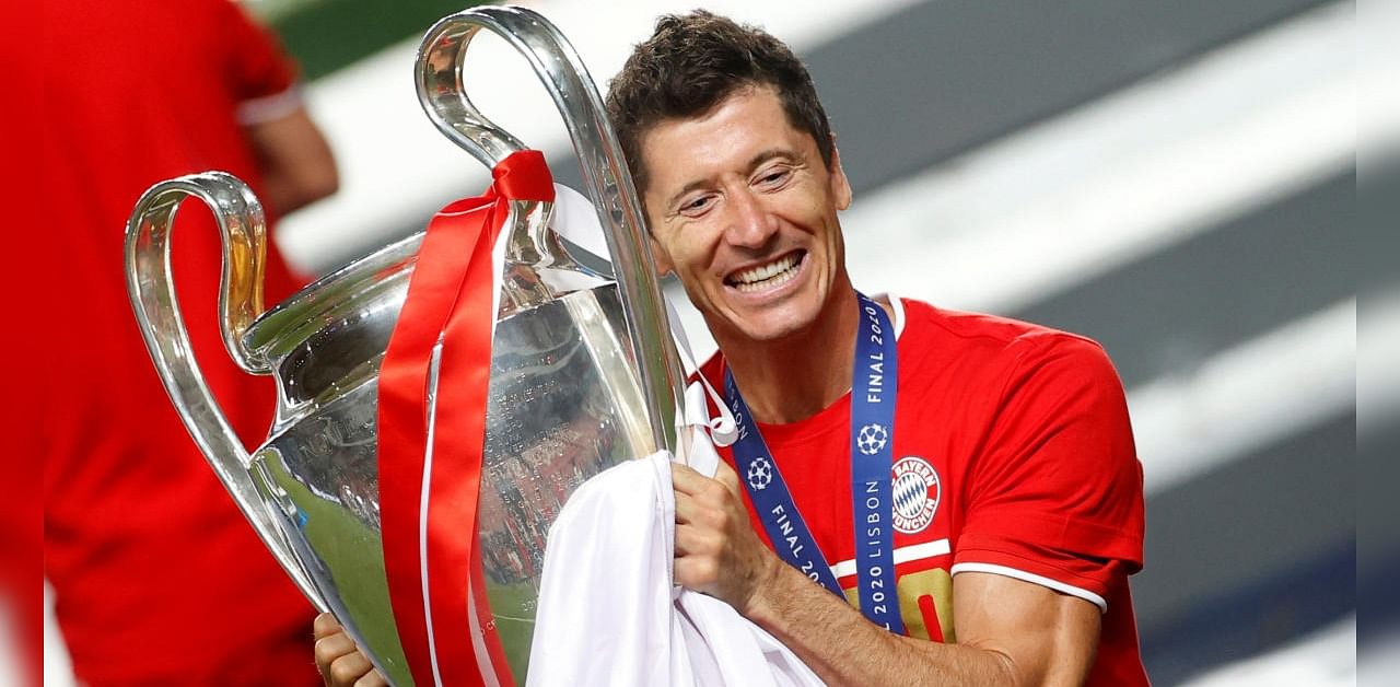 Bayern Munich's Robert Lewandowski celebrates with the trophy after winning the Champions League. Credits: Reuters
