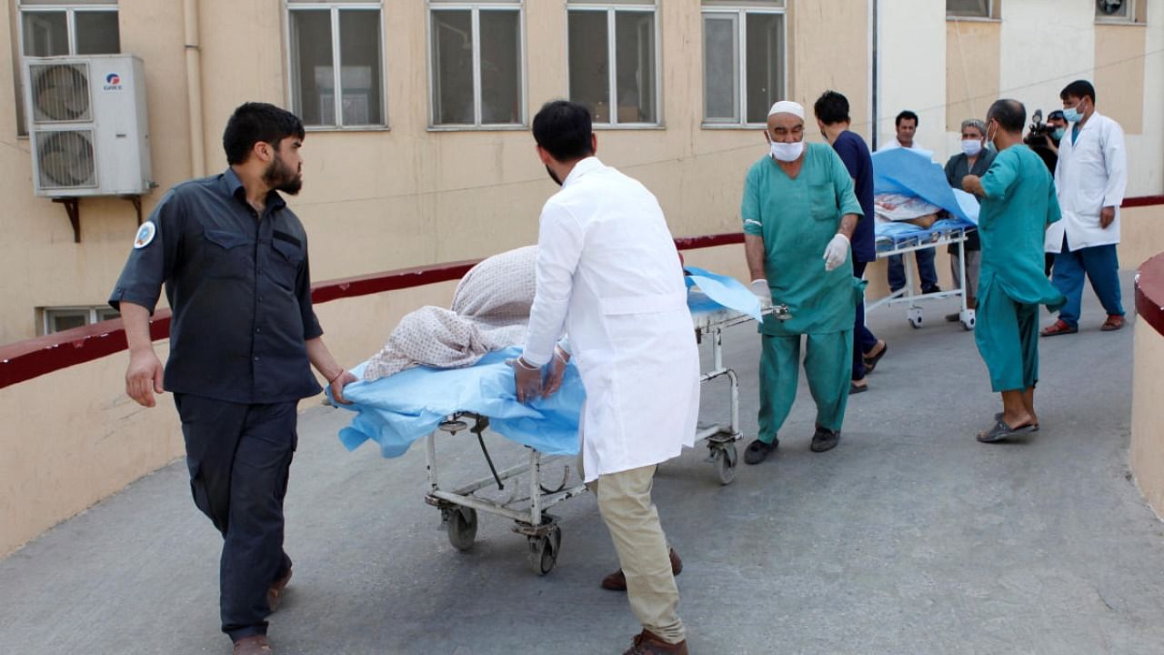 Hospital workers transfer injured people for treatment after a truck bomb blast in Balkh province, in Mazar-i-Sharif. Credit: Reuters
