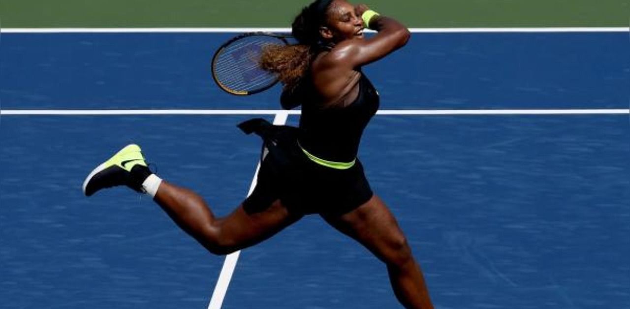 Serena Williams returns a shot to Arantxa Rus of Netherlands during the Western & Southern Open at the USTA Billie Jean King National Tennis Center. Credit: AFP Photo