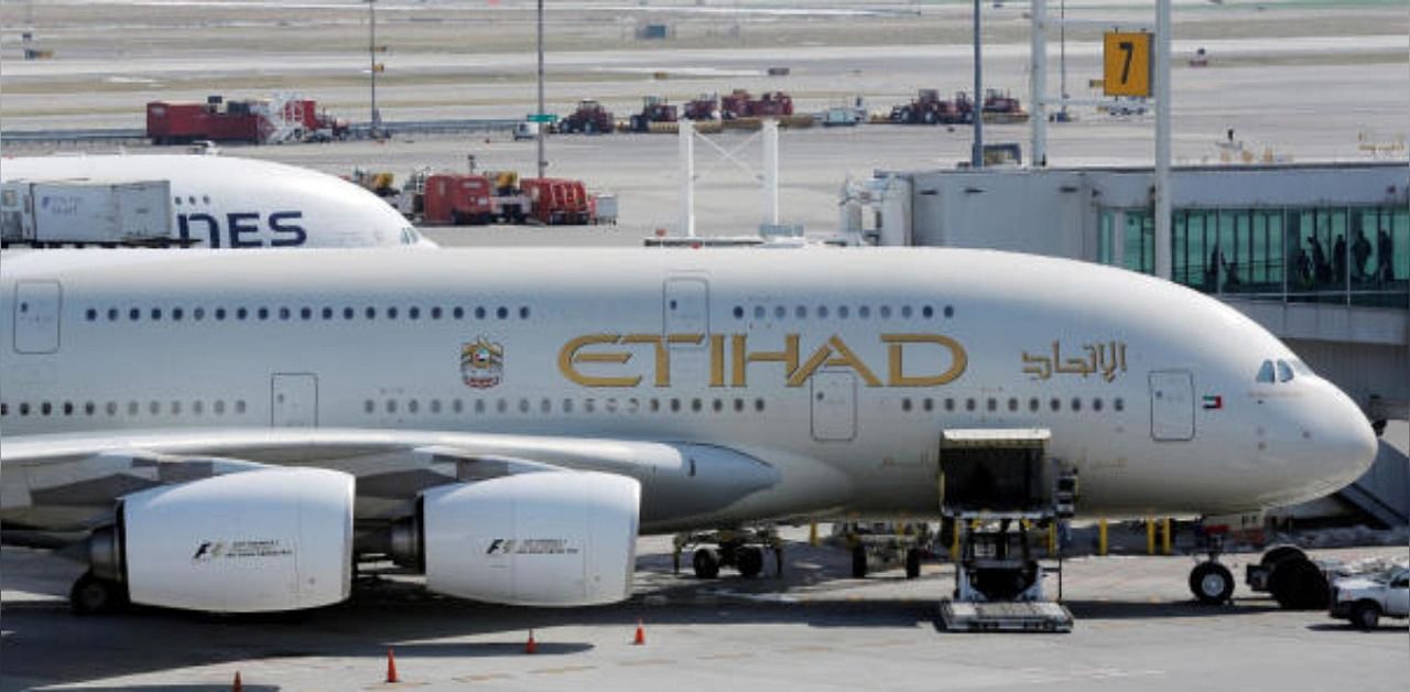 An Etihad plane stands parked at a gate at JFK International Airport in New York. Credit: Reuters Photo