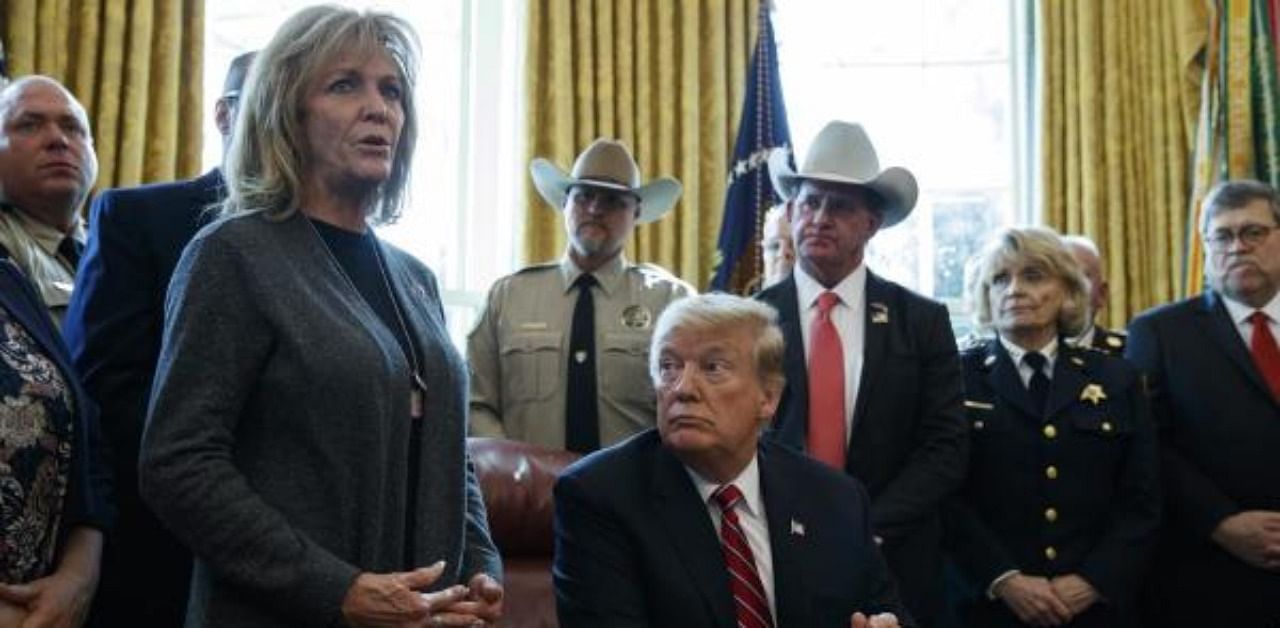 President Donald Trump listens as Mary Ann Mendoza, an "Angel Mom" who lost her son Brandon when he was killed by a drunk driver that was an undocumented immigrant. Credit: AP