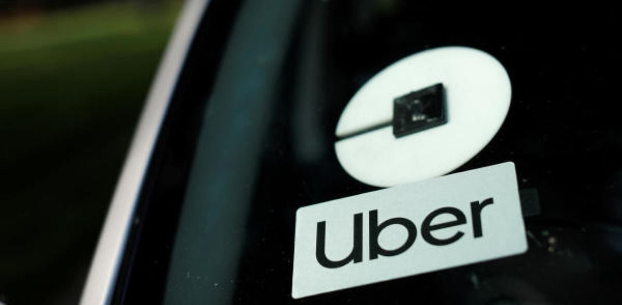 An Uber logo is shown on a rideshare vehicle. Credit: Reuters