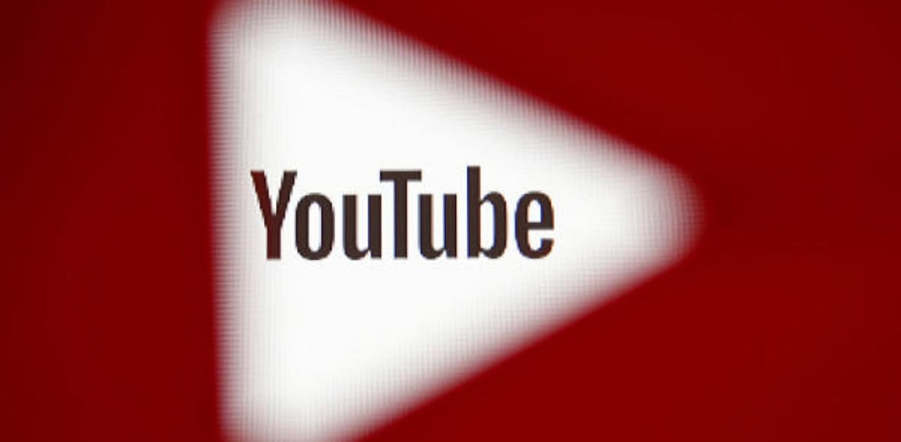  A 3D-printed YouTube icon is seen in front of a displayed YouTube logo. Credit: Reuters