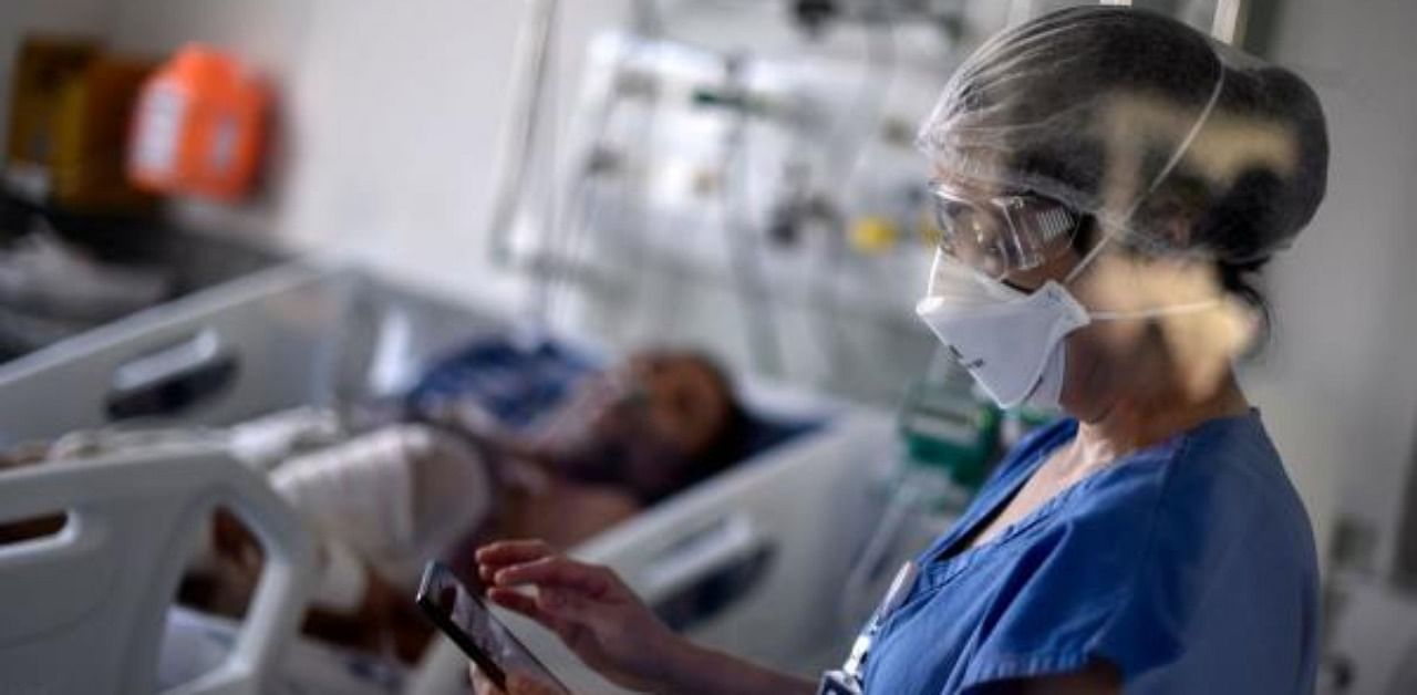 A health professional works at the Intensive Care Unit (ICU) ward where patients infected with the novel coronavirus are being treated. Credit: AFP