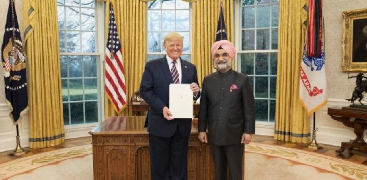 India's ambassador to the United States Taranjit Singh Sandhu with US President Donald Trump in his Oval Office of the White House. Credit: PTI Photo