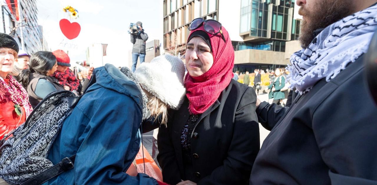Mosque shooting survivors celebrate with supporters following the sentencing of gunman Brenton Tarrant at the High Court in Christchurch, New Zealand. Credits: Reuters