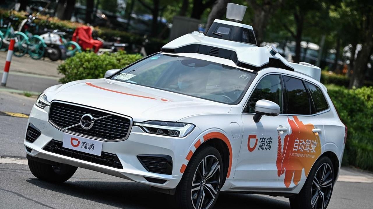 This photo taken on July 22, 2020 shows a Didi Chuxing autonomous taxi during a pilot test drive on the streets in Shanghai. Credit: AFP