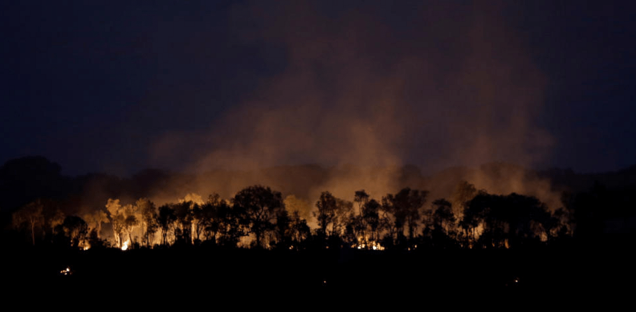 A tract of the Amazon jungle is seen burning. Credit: Reuters