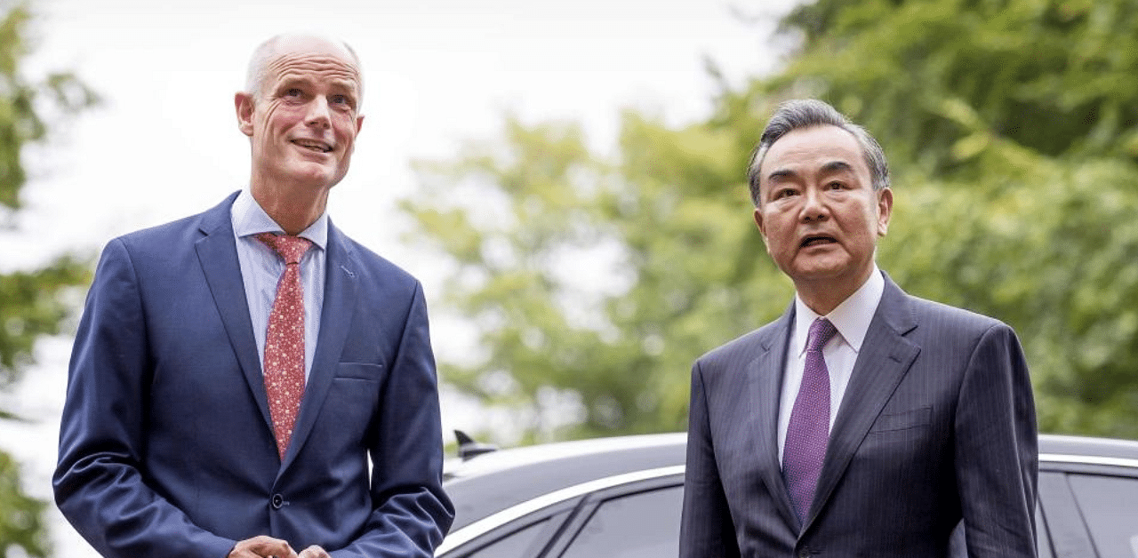 Dutch Minister of Foreign Affairs Stef Blok (L) welcomes his Chinese counterpart Wang Yi. Credit: AFP