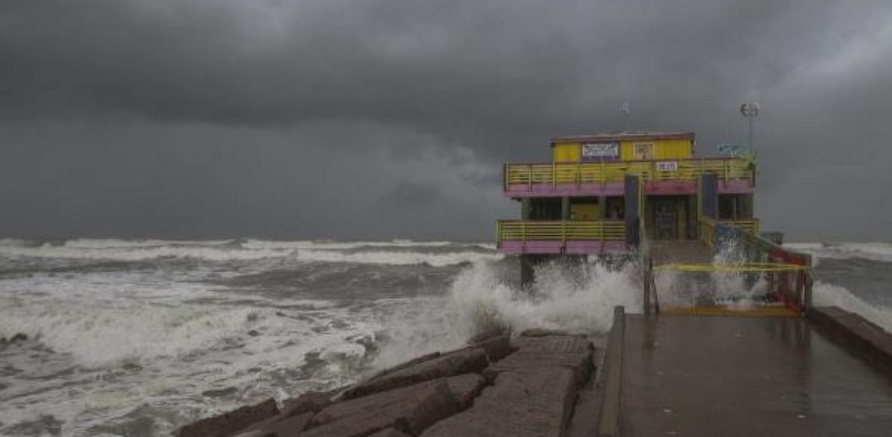 Waves from Hurricane Laura crash on the 61st Street fishing pier in Galveston, Texas. Credit: AFP