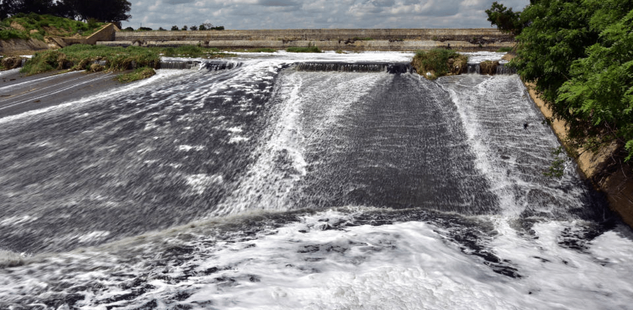 A file picture of polluted water overflowing from the Byramangala Lake near Bidadi on the outskirts of Bengaluru. Credit: DH Photo/Irshad Mohammed