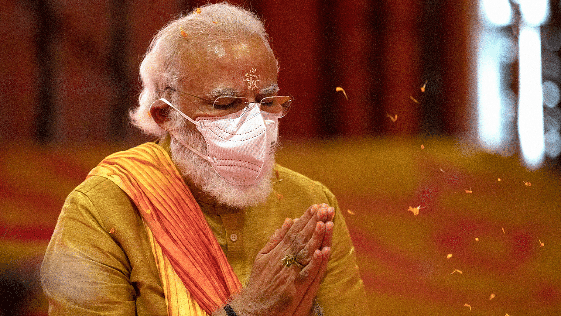 Prime Minister Narendra Modi performs rituals during the groundbreaking ceremony of a temple dedicated to the Hindu god Ram, in Ayodhya. Credits: AP Photo