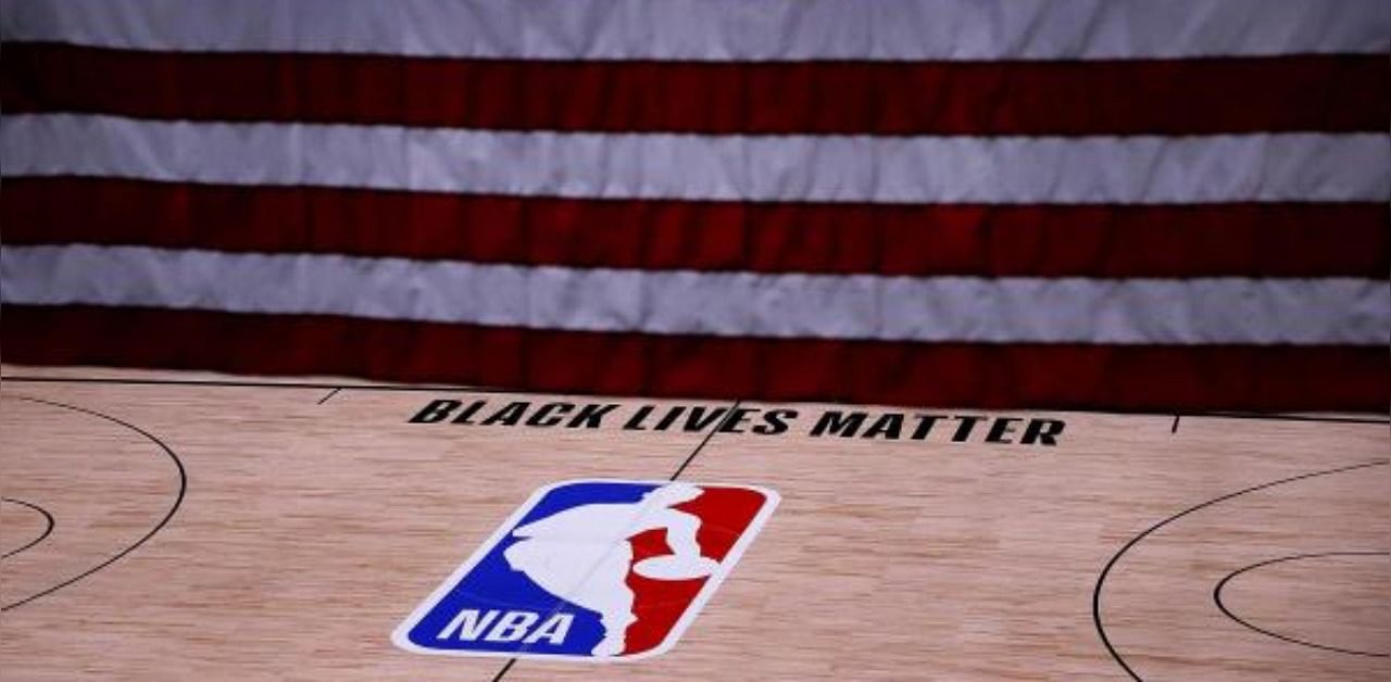The Black Lives Matter logo is seen on an empty court as all NBA playoff games were postponed today during the 2020 NBA Playoffs. Credit: AFP Photo