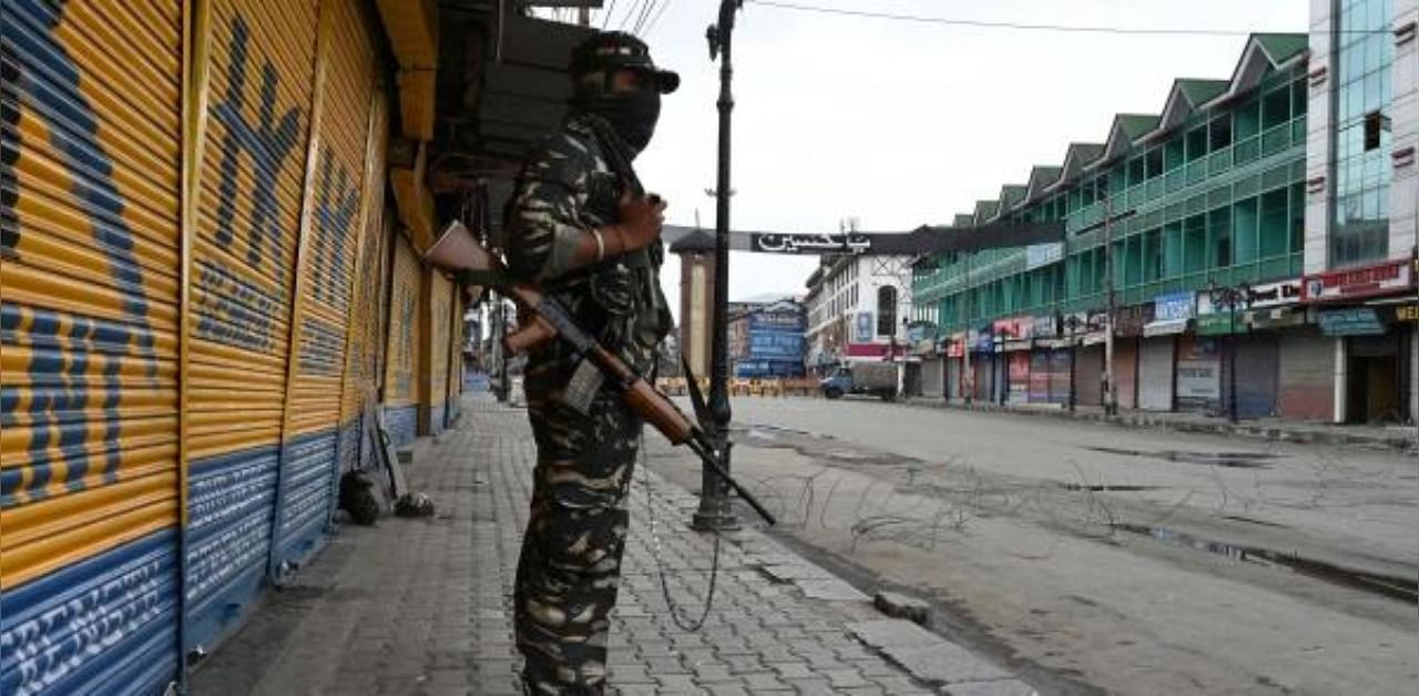 An Indian paramilitary trooper stands guard during restrictions imposed in various parts of the city to foil Muharram processions in Srinagar. Credit: AFP
