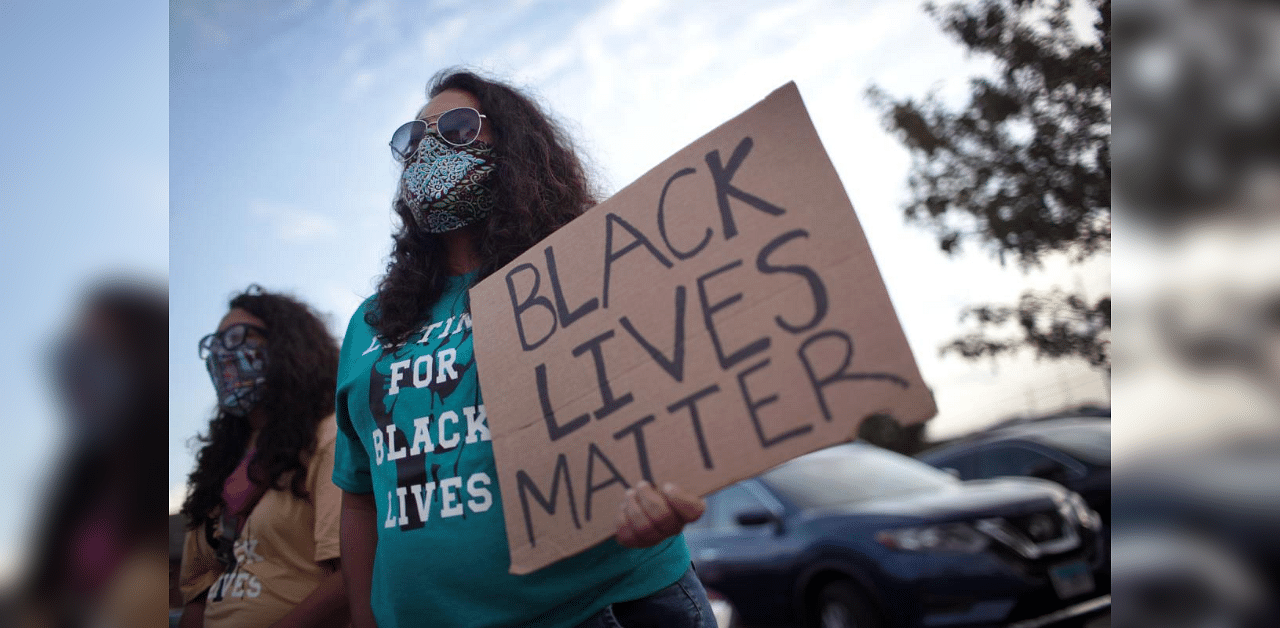 A small group of peaceful demonstrators protesting the shooting of Jacob Blake hold a rally in Kenosha. Credit: AFP