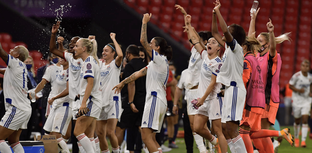 Lyon players celebrate at the end of the Women's Champions League semifinal soccer match between Lyon and Paris Saint-Germain. Credit: AP Photo