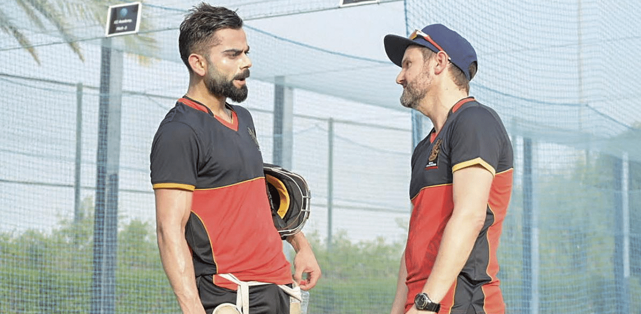  Royal Challengers Bangalore Captain Virat Kohli (L) during the team's first practice session for the impending 13th season of the Indian Premier League in Dubai. Credit: PTI Photo