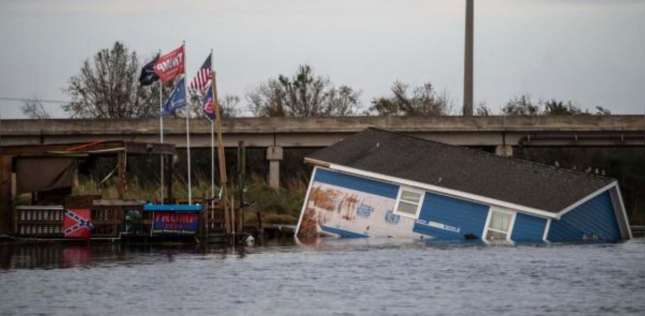 A building destroyed after the passing of hurricane Laura is seen partially submerged in the river in Hackberry, Louisiana. Credit: AFP Photo