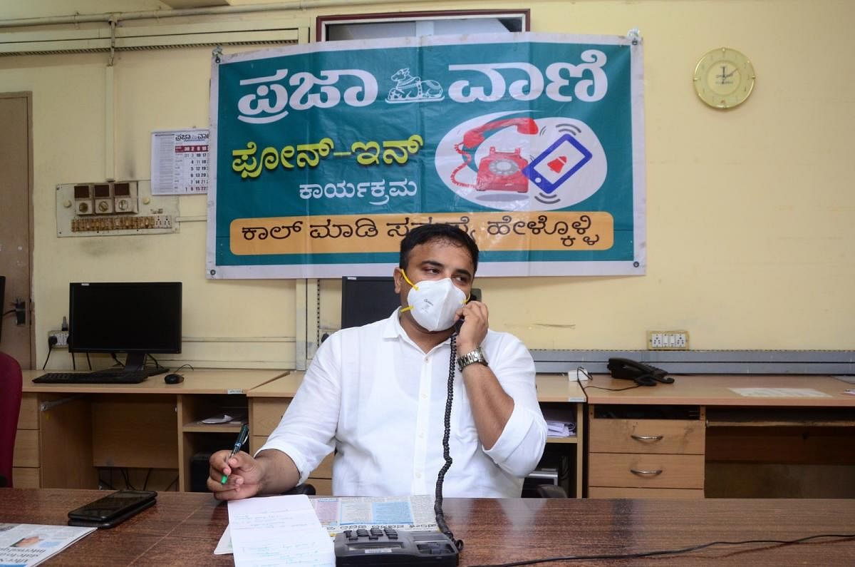 Deputy Commissioner Dr Rajendra K V receives a call during a phone-in programme organised by Prajavani, the sister publication of Deccan Herald, at DH-PV editorial office in Mangaluru on Saturday. 