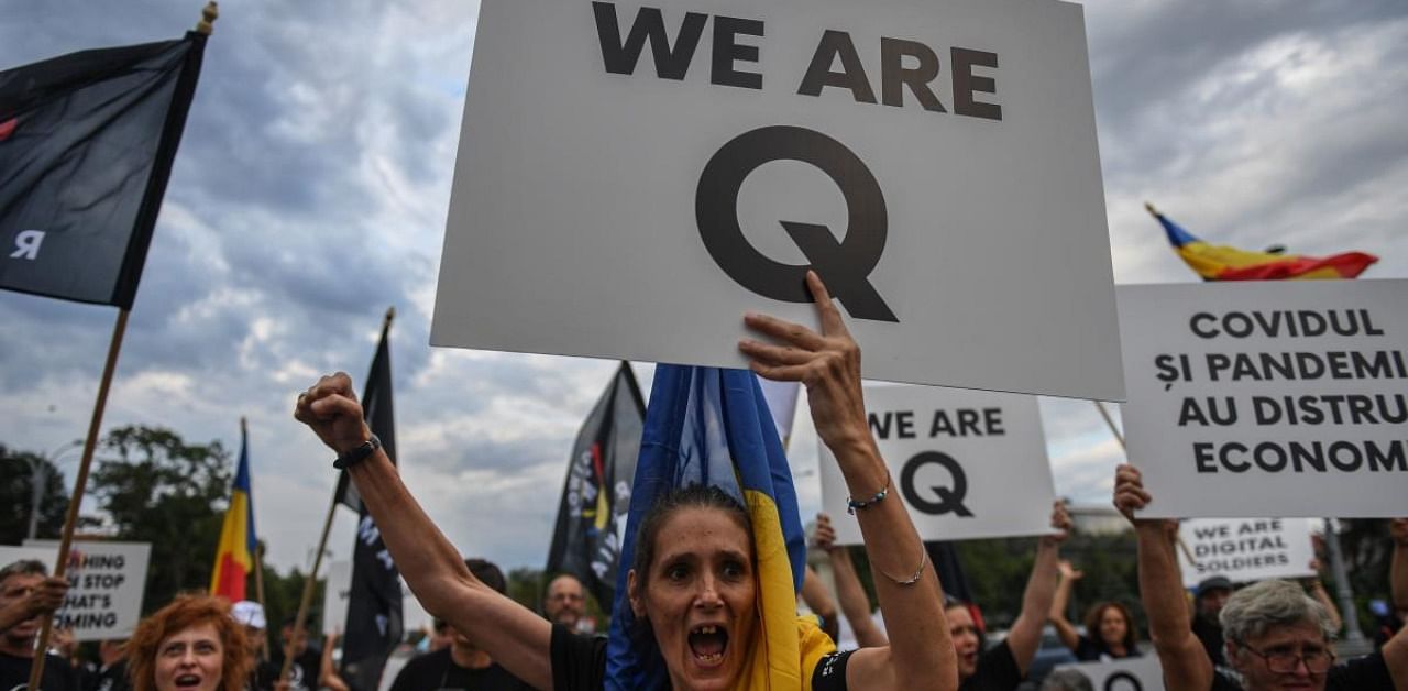 Some wore T-shirts promoting the “QAnon” conspiracy theory while others displayed white nationalist slogans and neo-Nazi insignia. Credits: AFP