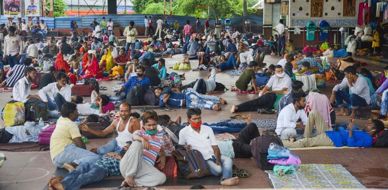 Passengers flouting social distancing norms while waiting at a railway station, during the Covid-19 weekend lockdown, in Bhubaneswar. Credits: PTI