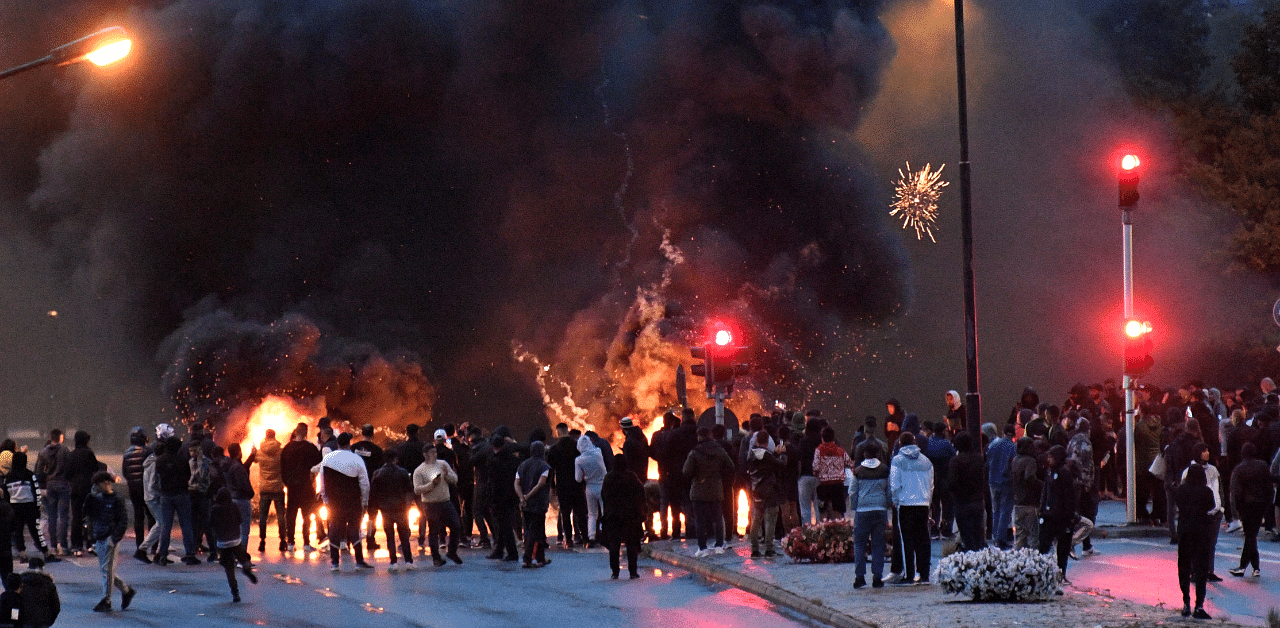 Smoke billows from the burning tyres, pallets and fireworks during a riot in the Rosengard neighbourhood of Malmo, Sweden. Credit: Reuters Photo