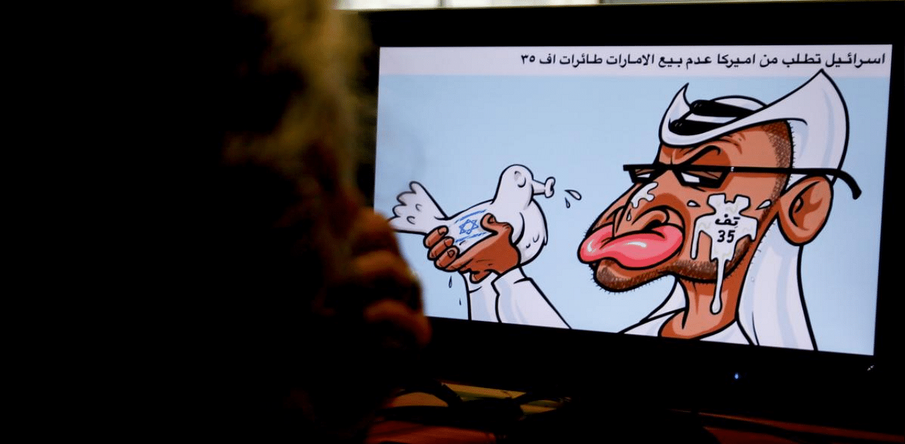 A caricature by Jordanian cartoonist Emad Hajjaj depicting the leader of the United Arab Emirates, Sheikh Mohammed bin Zayed Al-Nahyan, holding a dove with Israel's flag on it spitting in his face with Arabic writing referring to Israel's opposition to the sale of US F-35 aircrafts to the UAE. Credit: AFP Photo