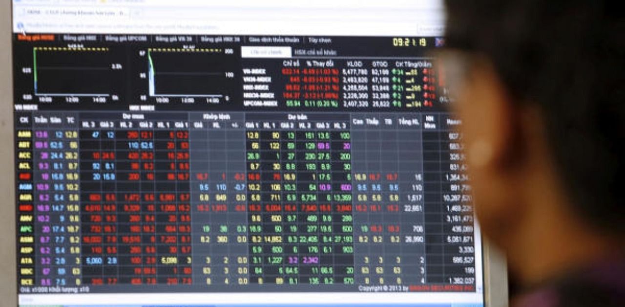 An investor looks at a stock market screen. Representative Photo. Credit: Reuters