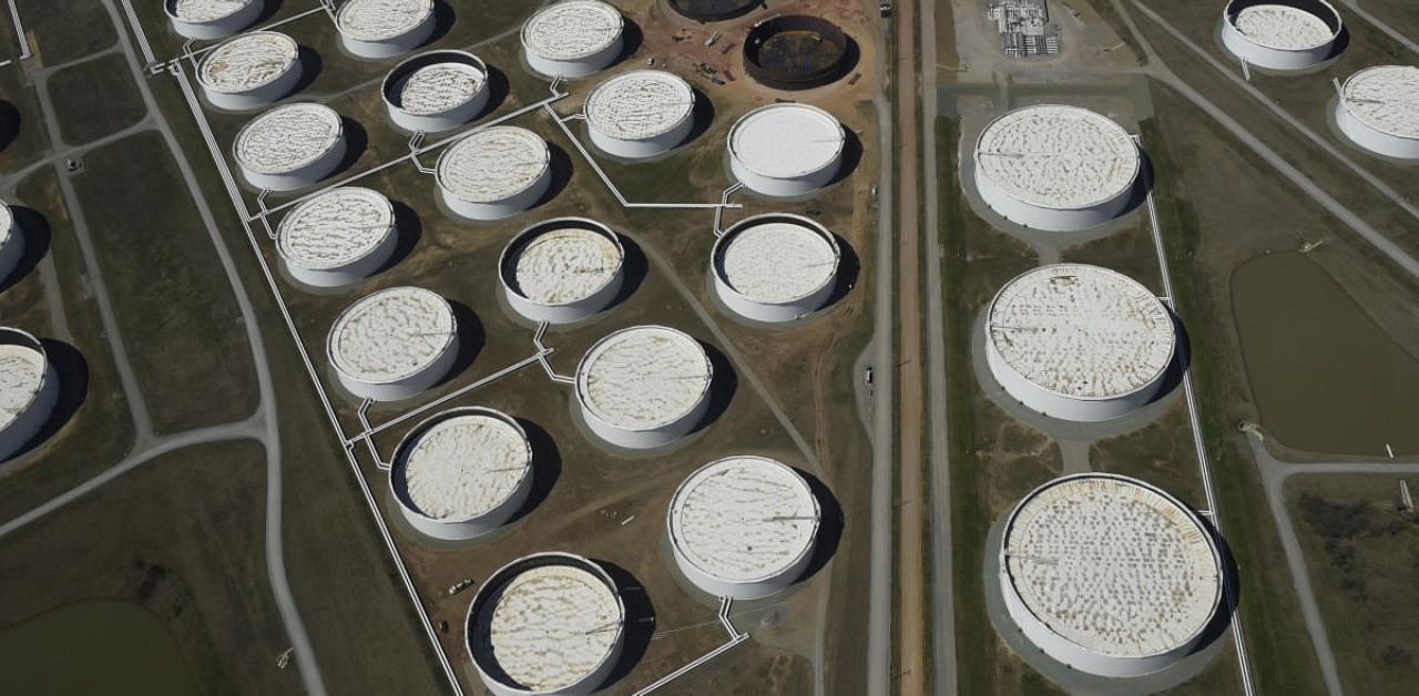 Crude oil storage tanks are seen from above at the Cushing oil hub, in Cushing, Oklahoma. Credits: Reuters