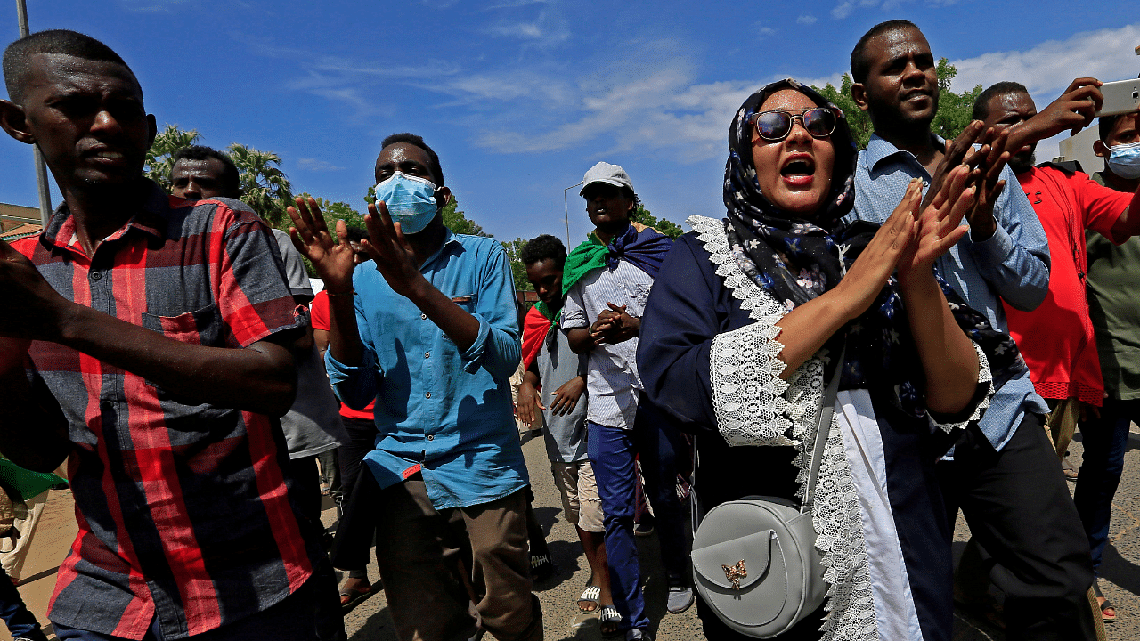 Sudanese protesters march in a demonstration to mark the anniversary of a transitional power-sharing deal with demands for quicker political reforms in Khartoum. Credits: Reuters Photo