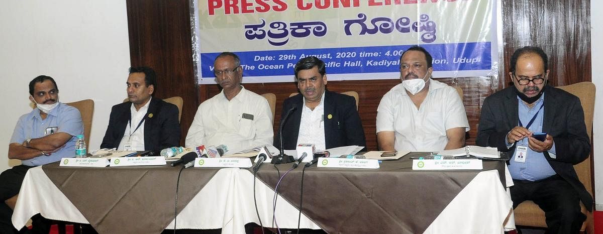 Karnataka Small Scale Industries Association President K B Arasappa speaks to reporters in Udupi.