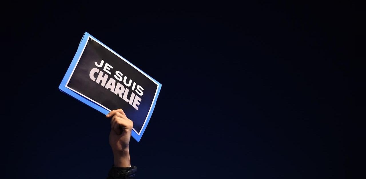 This file photo taken on January 7, 2015 shows a man holding a placard reading "I am Charlie" on the Old Harbor in Marseille, southern France, following an attack by unknown gunmen on the offices of the satirical weekly Charlie Hebdo. Credit: AFP Photo