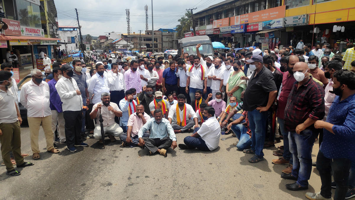 People’s representatives and members of various organisations stage a protest, demanding that a solution be found for the wild jumbo menace in Sakleshpur, Hassan district on Tuesday. 