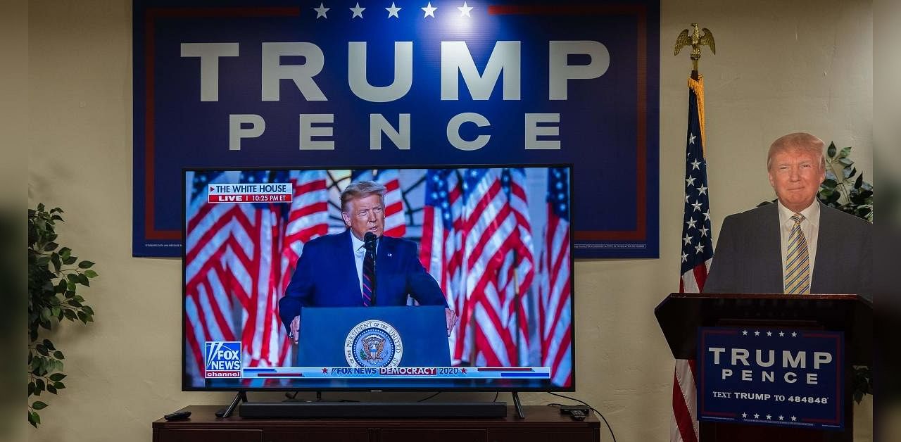 Lesser Trump campaign ads on TV. Credit: AFP Photo