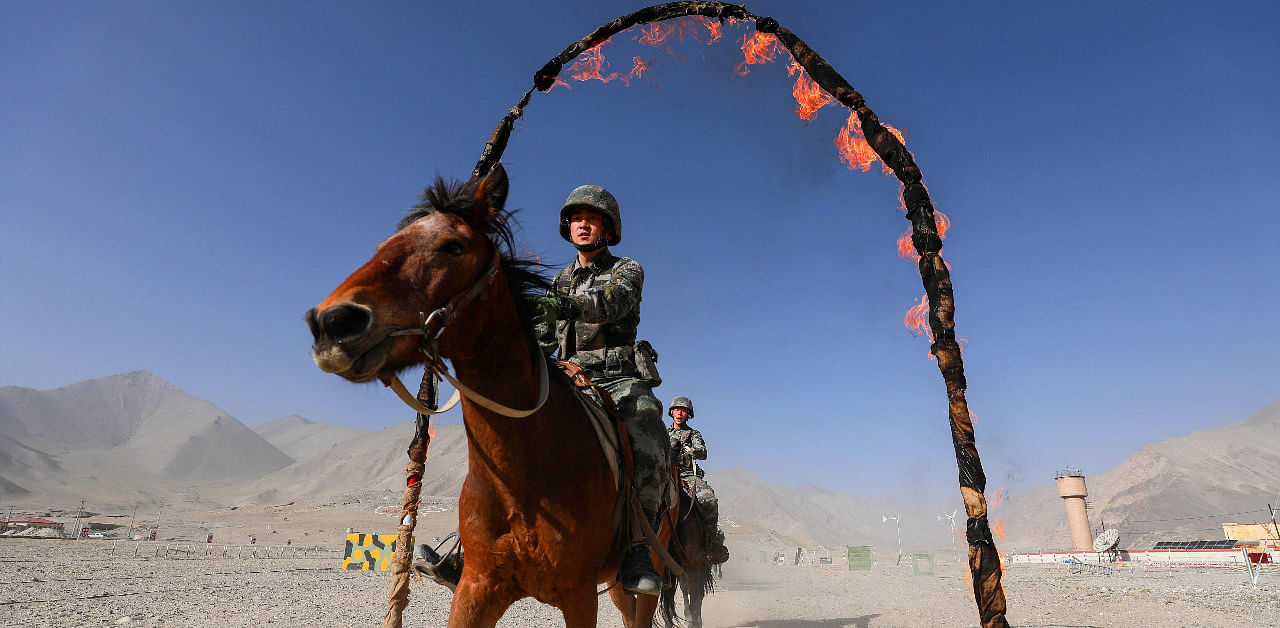 Chinese People's Liberation Army (PLA) soldiers take part in a training session at Pamir Mountains in Kashgar, in China's western Xinjiang region. Credit: AFP
